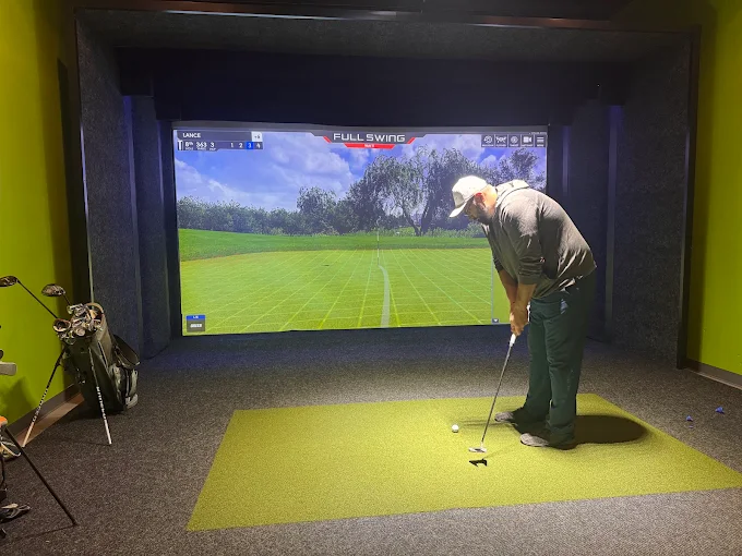 Indoor golf simulator bay at Steeltown Event Park