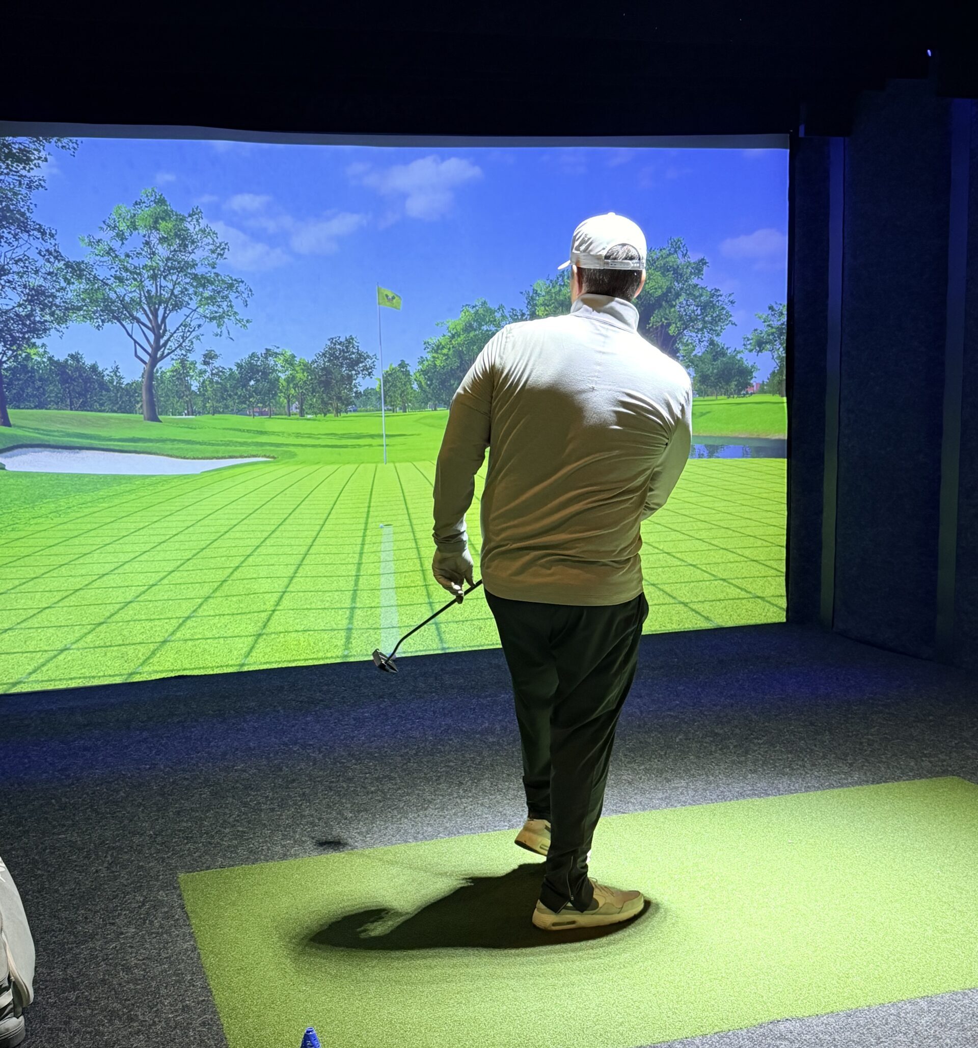 Friends enjoying indoor golf at Steeltown Event Park